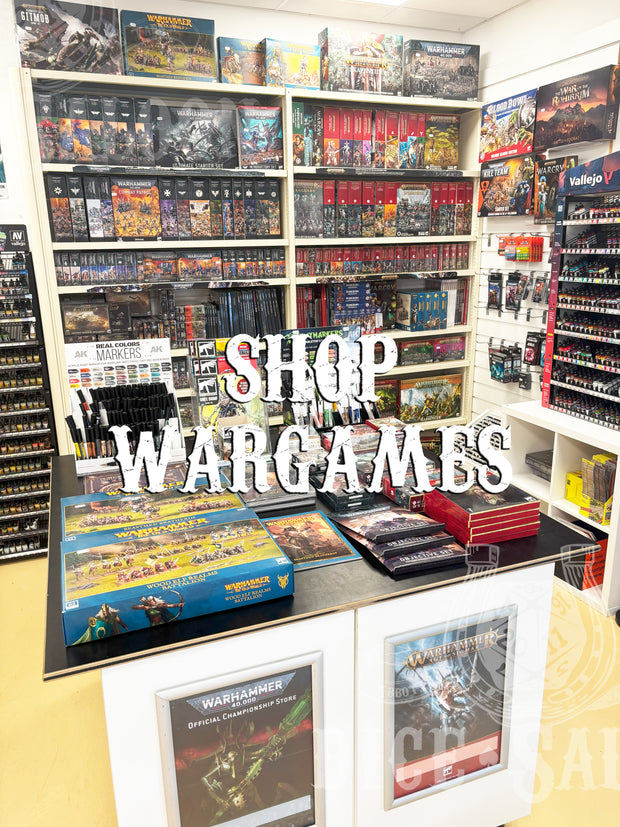 Display of wargames products with shelves and a 'Shop Wargames' sign.