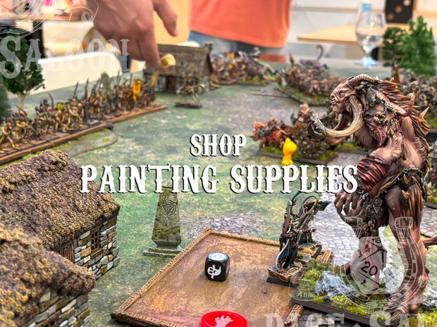 Model diorama with detailed figures and text overlay 'Shop Painting Supplies'.